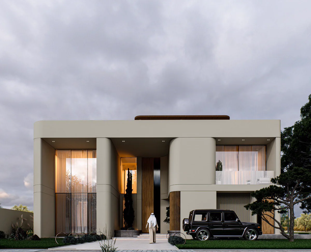 Exterior front view of contemporary beige villa with curved façade, double-height entrance and large glazing designed by Al Mujassam Architects.