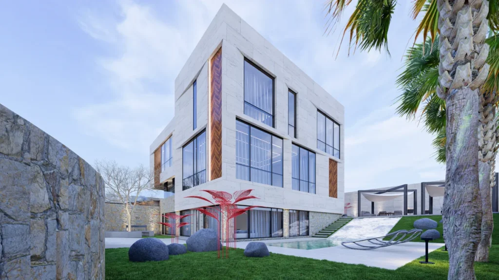 Wide garden shot of the modern stone villa with pool, sun loungers, red sculptural landscaping, and palm trees.